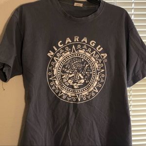 Light blue Nicaragua shirt with some stains.